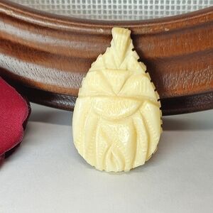 Vintage Carved Flower Bone or Bakelite Pendant